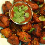 Crispy Baked Onion Bhajis Paired with Tangy Tamarind Sauce