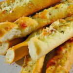 Golden Cheesy Garlic Breadsticks Perfect for Marinara Dip