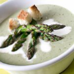 Velvety Cream of Asparagus Soup Topped with Crispy Croutons