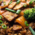Savory Tempeh & Veggie Rice Bowl Drizzled with Soy Sauce